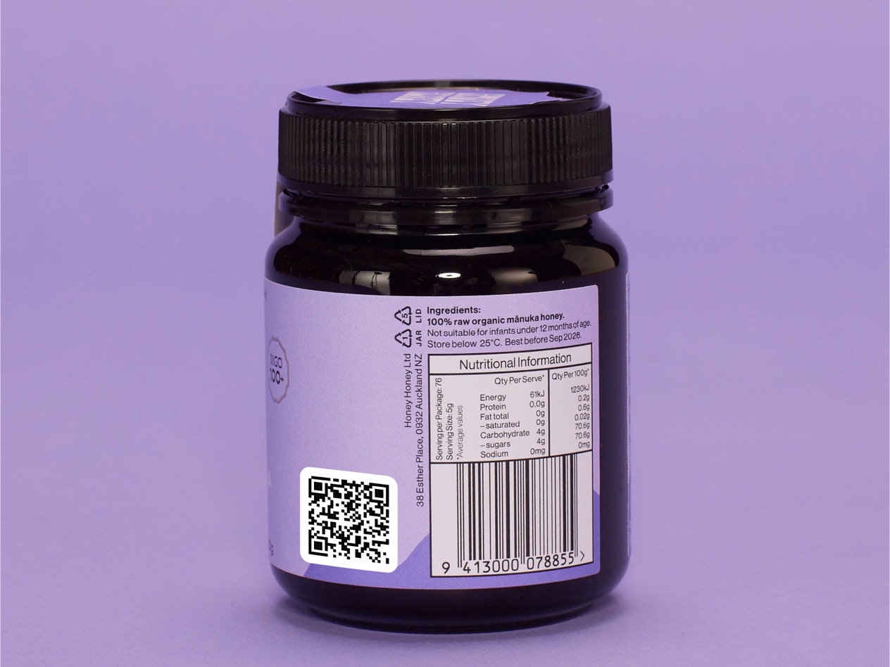 A honey jar with a QR code and a barcode printed on the label.